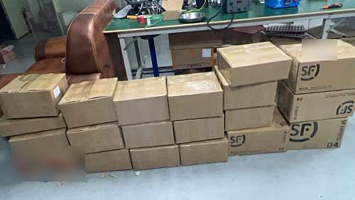 Stack of sealed cardboard cartons ready for courier shipping